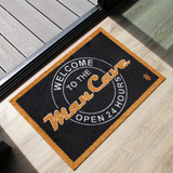 Matsmiths Man Cave Welcome Mat, Washable Indoor Mat with Rubber Backing, Large Funny Door Mat for Bars, Man Caves, Basements, Non-Slip Area Rug and Mat, Washable Entryway Rug, Pet Friendly, Black, Gold and White, 28” x 19”